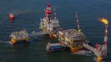 «Лукойл» ищет нефть у соседей: компания вложится в казахстанский шельф Каспия