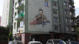 В Берлине на стене жилого дома появился «Зеленский-каннибал» — автора ищут
